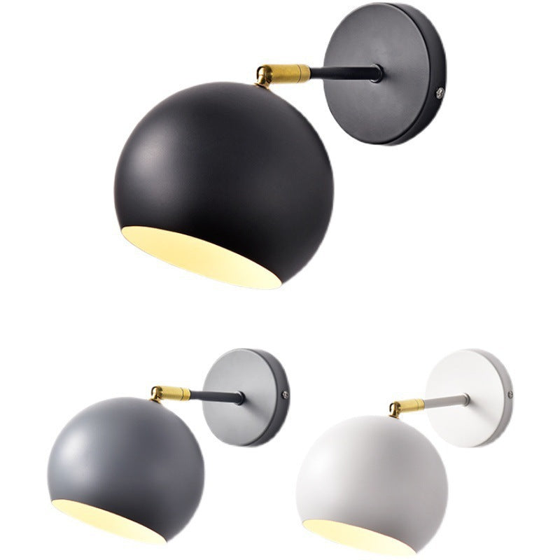Adjustable Matte Metal Globe Wall Lamp with Brass Pivot Arm | High & Bury