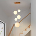 Cascading Glass Globe Pendant Lamp with Wooden Ceiling | High & Bury