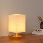 Compact Scandinavian Wooden Foot Table Lamp with Linen Lampshade | High & Bury