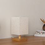 Compact Scandinavian Wooden Foot Table Lamp with Linen Lampshade | High & Bury