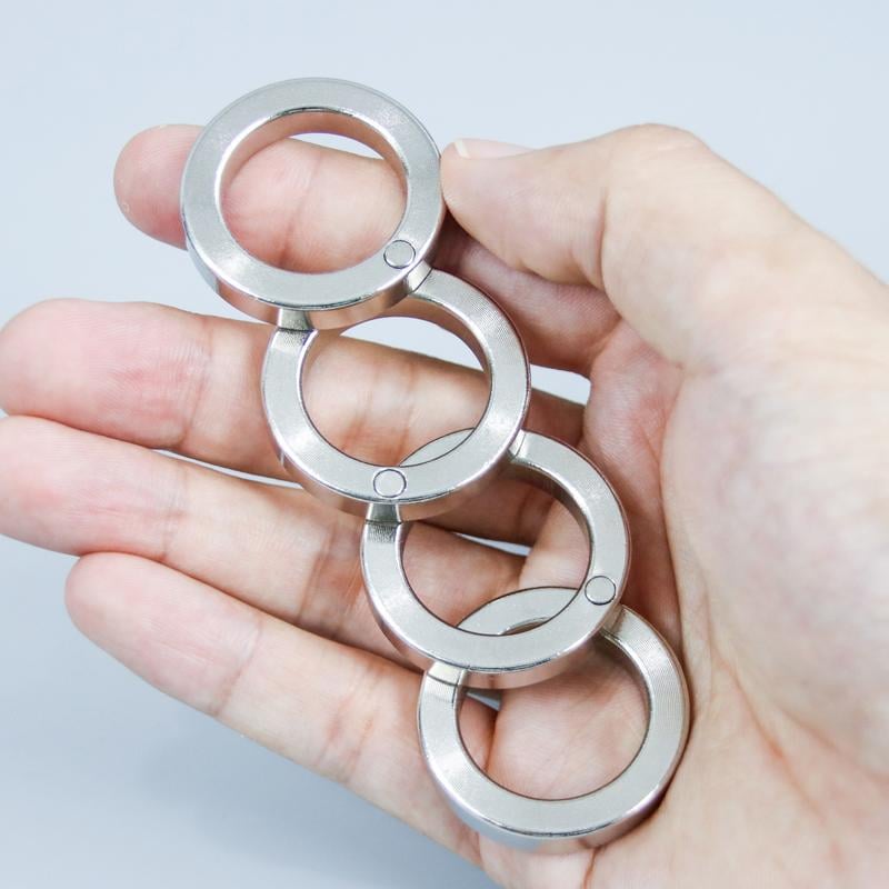 Folding Four-Finger Trigger Ring with Tactile Feedback for Pocket Carry